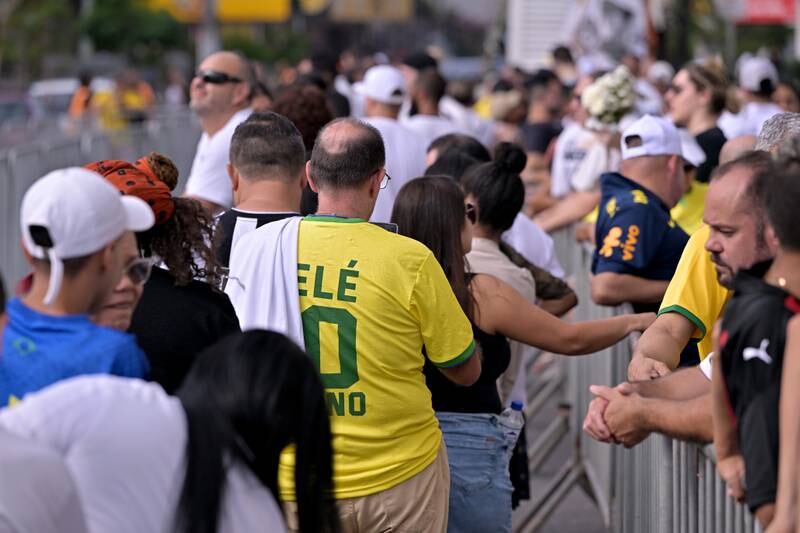 Mourners queue outside the Urbano Caldeira Stadium. Getty