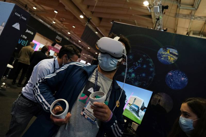 A man tries out VR goggles at the European Space Agency stand at the Web Summit, Europe's largest technology conference, in Lisbon on Tuesday. Reuters