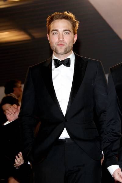 Channelling his formal best in a black tuxedo, Robert Pattinson departs the 'Cosmopolis' premiere during the 65th Annual Cannes Film Festival on May 25, 2012. Getty Images