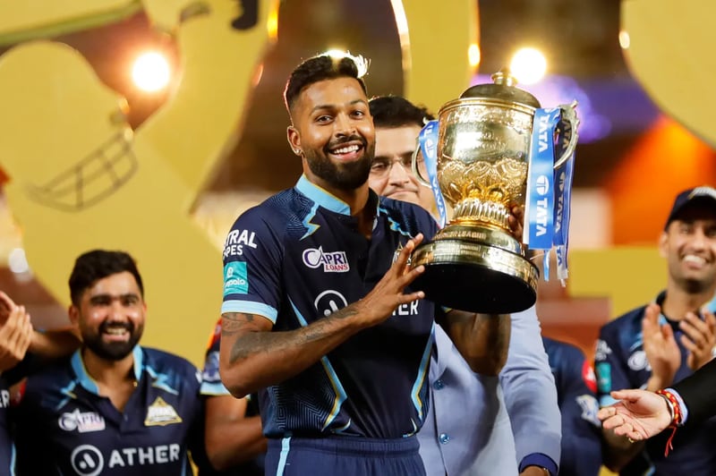 Gujarat Titans captain Hardik Pandya lifts the IPL trophy after the win over Rajasthan Royals in the final at the Narendra Modi Stadium in Ahmedabad on Sunday, May 29, 2022. Sportzpics / IPL
