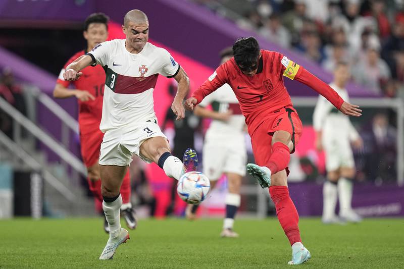 Portugal's Pepe attempts to block a shot by South Korea captain Son Heung-min. AP