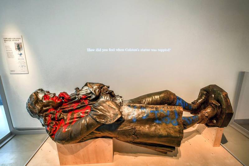 A view of the statue of slave trader Edward Colston, which was toppled during a protest on June 7, 2020 on display at the M Shed as part of the preview of 'The Colston statue: What next?', in Bristol, England, Thursday June 3, 2021. A statue of a 17th-century slave trader that was toppled during anti-racism protests in the English city of Bristol is being displayed in a museum, with visitors being asked to help decide its fate. The bronze likeness of Edward Colston was pulled from its pedestal and dumped in Bristol harbor a year ago, sparking a nationwide debate about commemoration and Britain‚Äôs slave-trading history. City workers hauled the statue out of the water and have kept it in storage ever since. (Ben Birchall/PA via AP)