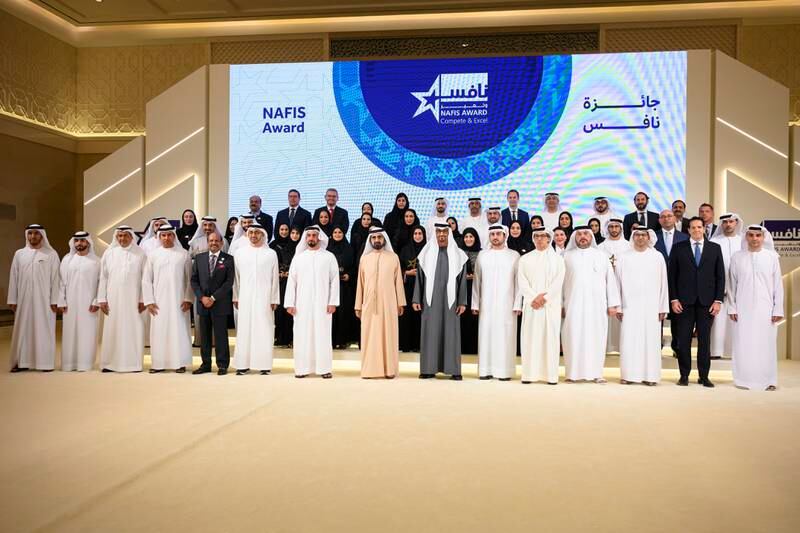 President Sheikh Mohamed with Nafis Award winners during a reception at Qasr Al Watan. Also pictured are Sheikh Mansour bin Zayed, Deputy Prime Minister and Minister of the Presidential Court; Sheikh Maktoum bin Mohammed, Deputy Prime Minister and Minister of Finance; Sheikh Mohammed bin Rashid, Vice President and Ruler of Dubai; Sheikh Saif bin Zayed, Deputy Prime Minister and Minister of Interior; Sheikh Abdullah bin Zayed, Minister of Foreign Affairs and International Co-operation; Yusuff Ali, managing director of Emke Group; Ghannam Al Mazrouei, secretary general of the Emirati Talent Competitiveness Council; Dr Abdulrahman Al Awar, Minister of Human Resources and Emiratisation and other dignitaries. All photos: Presidential Court