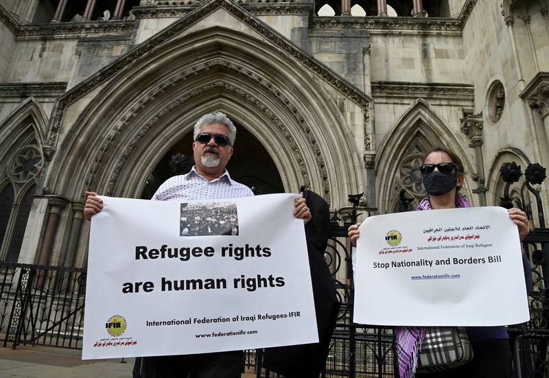 Refugee rights activists protest at the Royal Courts of Justice, London. Prince Charles is said to be unhappy over the UK government's policy to deport of asylum seekers from Britain to Rwanda. Reuters.