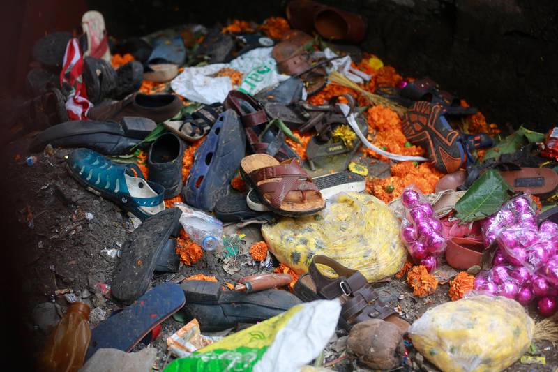 Footwear and other items lie at the site of a pedestrian bridge stampede in Mumbai, India, Friday, Sept. 29, 2017. The stampede broke out on a crowded pedestrian bridge connecting two railway stations in Mumbai during the Friday morning rush, killing a number of people police said. (AP Photo/Rafiq Maqbool)