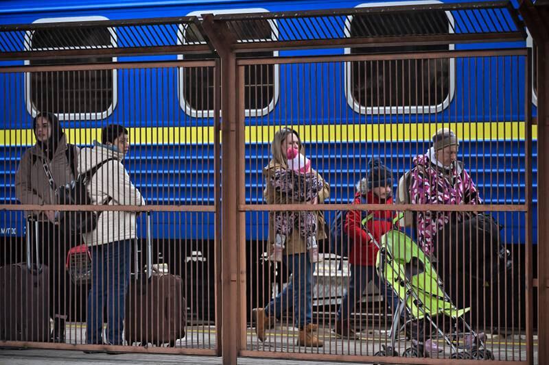 Women and children make their way through Przemysl railway station in Poland after journeying from war-torn Ukraine.  Getty Images