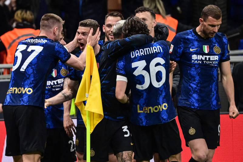 Inter Milan's German defender Robin Gosens celebrates with teammates after scoring. AFP