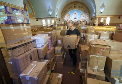 Boxes of donations destined for Ukraine at the St Michael's Ukrainian Catholic Church in Montreal, Canada. AP