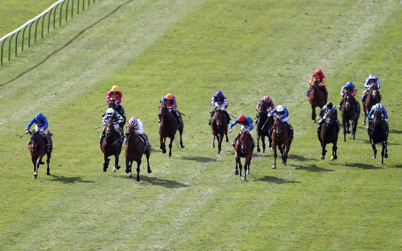Poetic Flare, ridden by jockey Kevin Manning, on the way to winning the 2000 Guineas Stakes. PA
