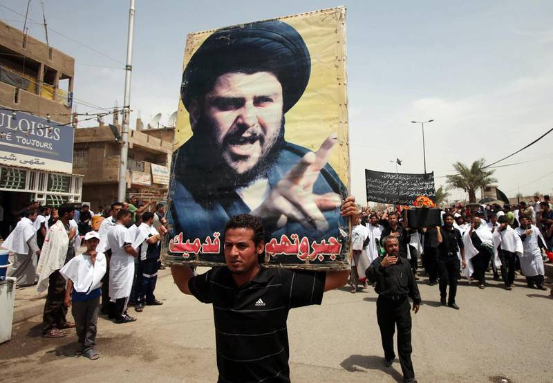 Followers of radical Shia cleric Muqtada Al Sadr march in the Sadr City neighborhood of Baghdad (AP Photo/Karim Kadim)