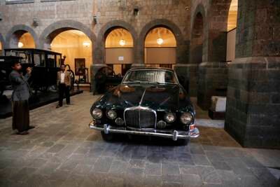 Visitors check out a Jaguar car, that was used to drive late Queen Elizabeth II around Aden in 1954, on display at the Military Museum in Sana'a, Yemen, 25 May 2023.  Among the Aden motorcade of late British Queen Elizabeth II, two Ford and Jaguar 420 cars are on display at the Military and National Museums in Sana'a.  The British queen's death has prompted some Yemenis to remember her visit to the southern part of their country in 1954.  The two cars were used to drive Queen Elizabeth II around Aden in April 1954 during her visit to south Yemen as a part of a six-month tour of the Commonwealth just two years into the monarch's reign, according to museum officials and documents.  At the time, south Yemen was a colony of the British Empire, until British forces left in 1967.  The two cars were transferred from the southern Yemeni city of Aden to the capital Sana'a in the mid 90's after a civil war broke out in Aden.  Queen Elizabeth II died on 08 September 2022, at the age of 96.   EPA / YAHYA ARHAB