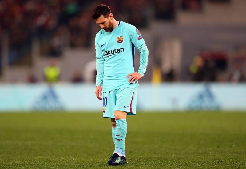 A dejected Lionel Messi of Barcelona after their defeat to Roma in the Uefa Champions League quarter-final second-leg match in Rome. Catherine Ivill / Getty Images