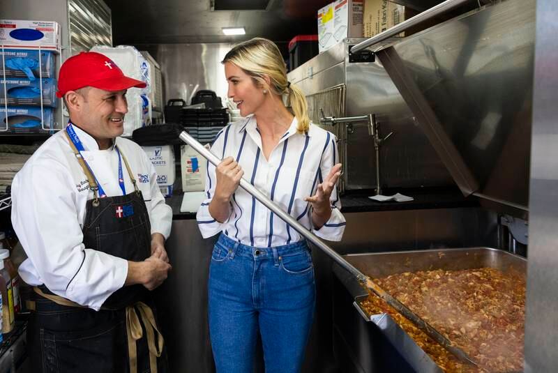 Ivanka Trump stirs chicken creole as she talks to Mercy Chefs' Chef Jay Bachman at Aycock Barn in Arabi, Louisiana. The Times-Picayune / The New Orleans Advocate / AP