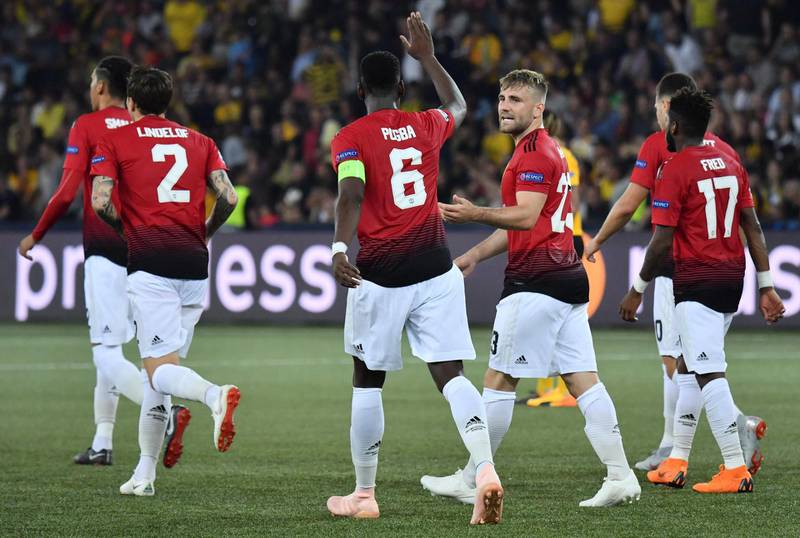 Pogba celebrates with teammate Luke Shaw, second right, after scoring his penalty in the 3-0 win. AFP