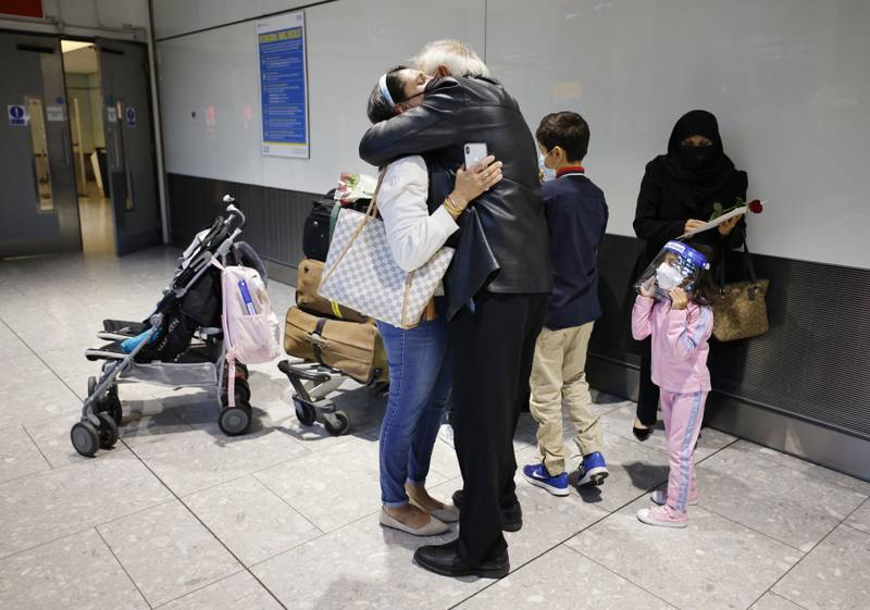 Loved-ones arriving from the US at Heathrow. AFP