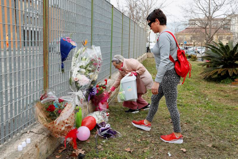 People lay tributes in Crotone. Reuters