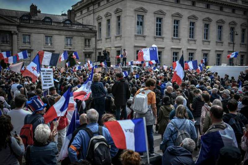 Demonstrators gather in Paris to protest against the expansion of Covid-19 health pass. AFP