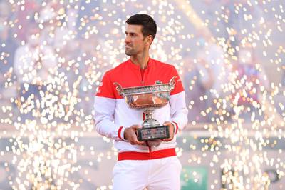 PARIS, FRANCE - JUNE 13: Novak Djokovic of Serbia celebrates as he holds the trophy after winning his Men's Singles Final match against Stefanos Tsitsipas of Greece during Day Fifteen of the 2021 French Open at Roland Garros on June 13, 2021 in Paris, France. (Photo by Clive Brunskill/Getty Images)
