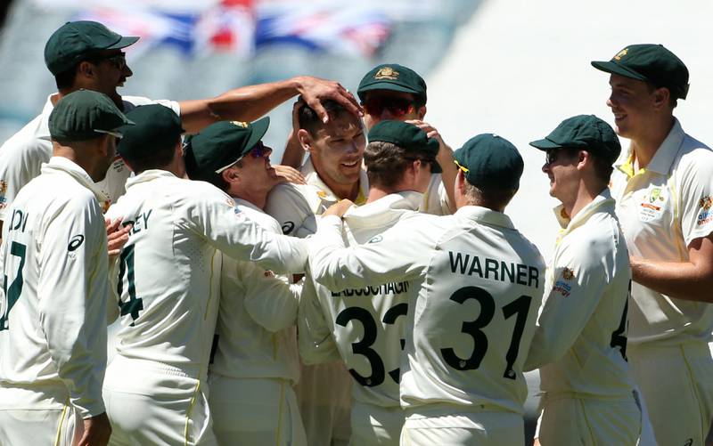 Australia's paceman Scott Boland (C) celebrates the wicket of England batsman Ollie Robinson. AFP