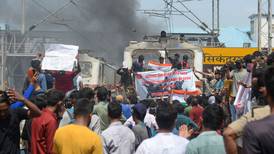 One killed in India as protesters vandalise buses and trains over military hiring