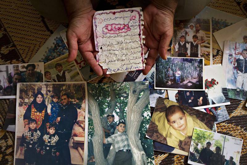 Fayez Salha holds a hand-written letter from his dead son Dia El Din. Mr Salha, 51, lost four children, his wife and her sister in an Israeli airstrike on his home in northern Gaza on January 8, 2009. Heidi Levine for The National