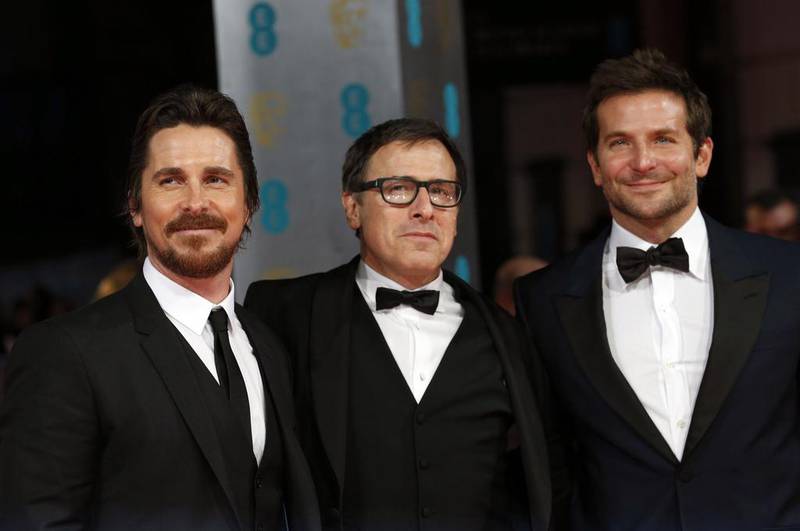 Left to right, actor Christian Bale, director David Russell and actor Bradley Cooper arrive at the British Academy of Film and Arts (BAFTA) awards ceremony at the Royal Opera House in London on February 16, 2014.  Suzanne Plunkett / Reuters