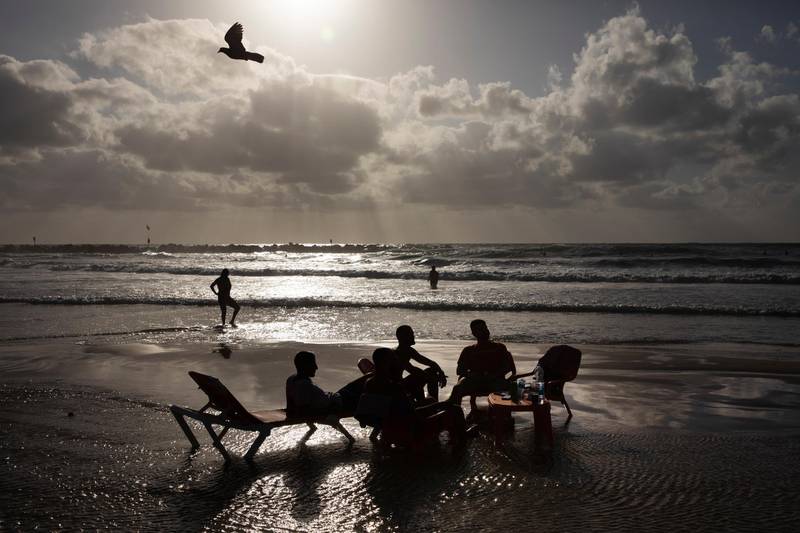 People enjoy the beachfront in Tel Aviv, Israel, on Saturday, May 22, 2021. AP
