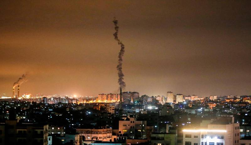 The smoke trail of a rocket, fired by Palestinian militants, flying over the Gaza Strip.  AFP