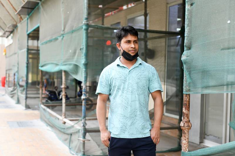 Abu Dhabi, United Arab Emirates - Mustafa Mohammed, 33, originally from Bangladesh works as a watchman in Tourist Club Area for the last 11 years. Khushnum Bhandari for The National
