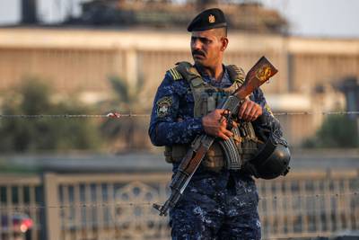 A police officer stands guard in the Iraqi capital Baghdad, where fears of another outbreak of deadly violence are mounting. AFP