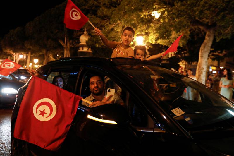 President Kais Saied supporters celebrate in Tunis after the exit poll indicates voters backed Tunisia's new constitution. Reuters