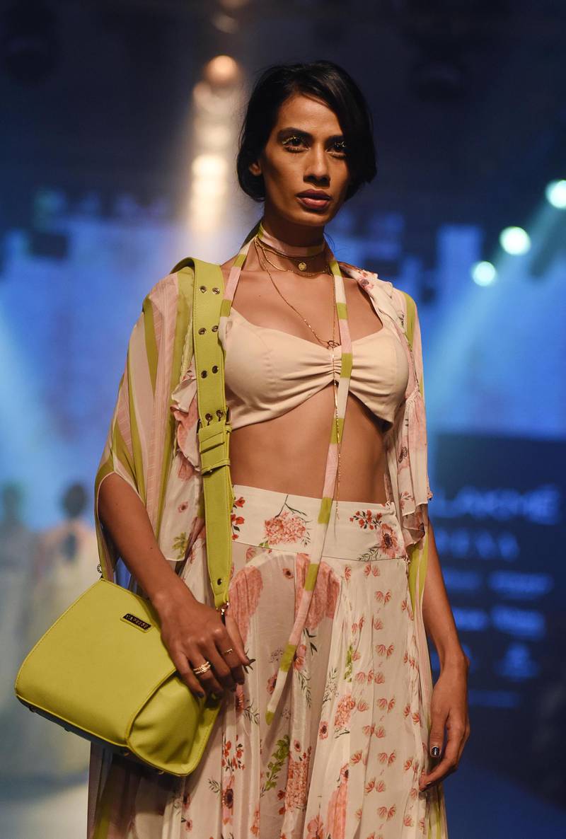 Designer Arpita Mehta pairs her outfits with pastel-coloured purses. AFP