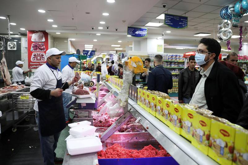 People shop in a mall amid concerns over the coronavirus spread in Amman, Jordan. Reuters