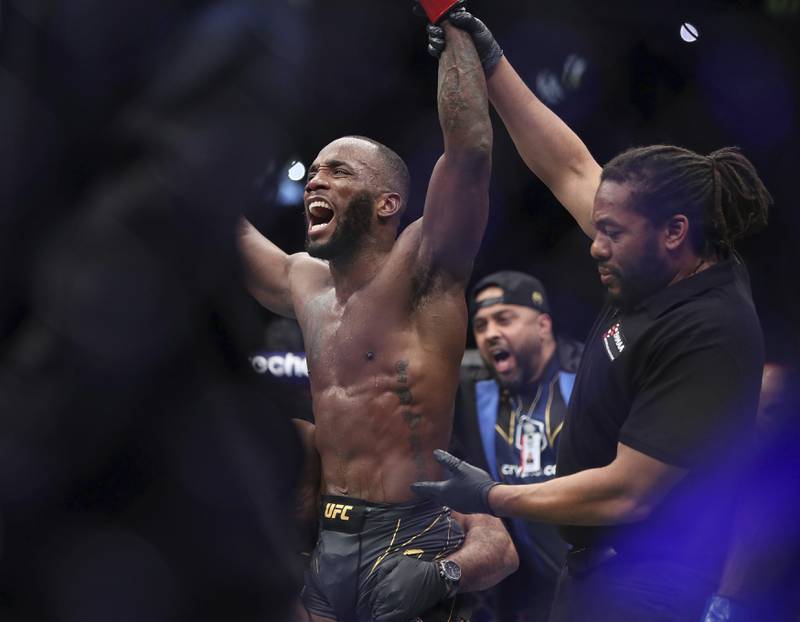 Leon Edwards celebrates his victory over Kamaru Usman in their welterweight title bout at UFC 286. PA