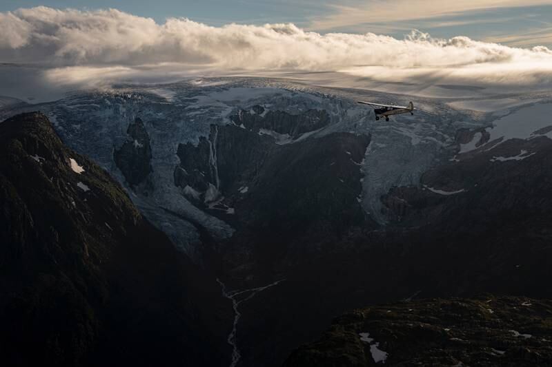 Fisher flies his plane above the Folgefonna glacier in Norway