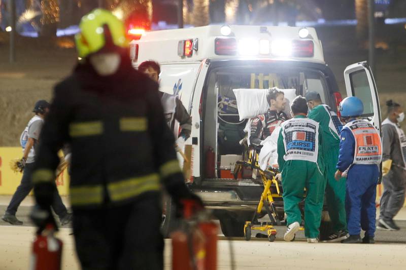 Romain Grosjean is taken into an Ambulance. PA