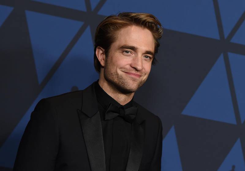 FILE - This Oct. 27, 2019 file photo show actor Robert Pattinson at the Governors Awards in Los Angeles. Warner Bros. is delaying a batch of releases including â€œThe Batmanâ€ and â€œThe Sopranosâ€ prequel â€œThe Many Saints of Newark.â€ The studio said Monday, April 20, 2020 that â€œThe Sopranosâ€ film will be pushed from September 2020 to a March 2021 release, while â€œThe Batmanâ€ starring Pattinson will be delayed four months to October 2021.  (Photo by Jordan Strauss/Invision/AP, File)