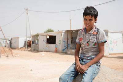 Ali lives with his mother and four siblings at Za'atari. He has a job working as fruit picker and until recently had not been going to school for two years. Photo: Save the Children/Jordi Matas