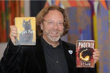 The author SF Said with his books Varjak Paw and Pheonix Courtesy SF Said