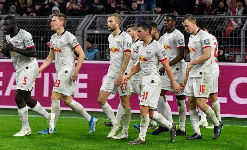 Leipzig's players walk back after scoring during the German Bundesliga soccer match between Borussia Dortmund and RB Leipzig in Dortmund, Germany, Tuesday, Dec. 17, 2019. The match ended 3-3. (AP Photo/Martin Meissner)