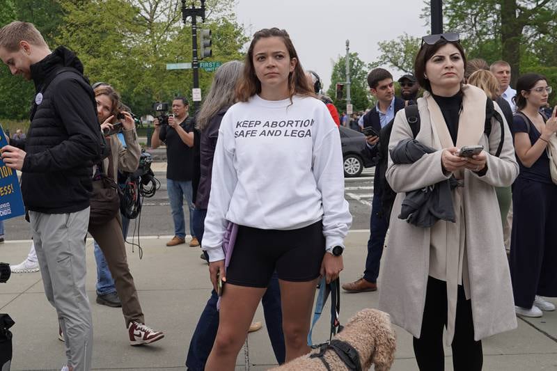 A woman wears a 'Keep Abortion Safe and Legal' sweatshirt outside the Supreme Court. Willy Lowry / The National