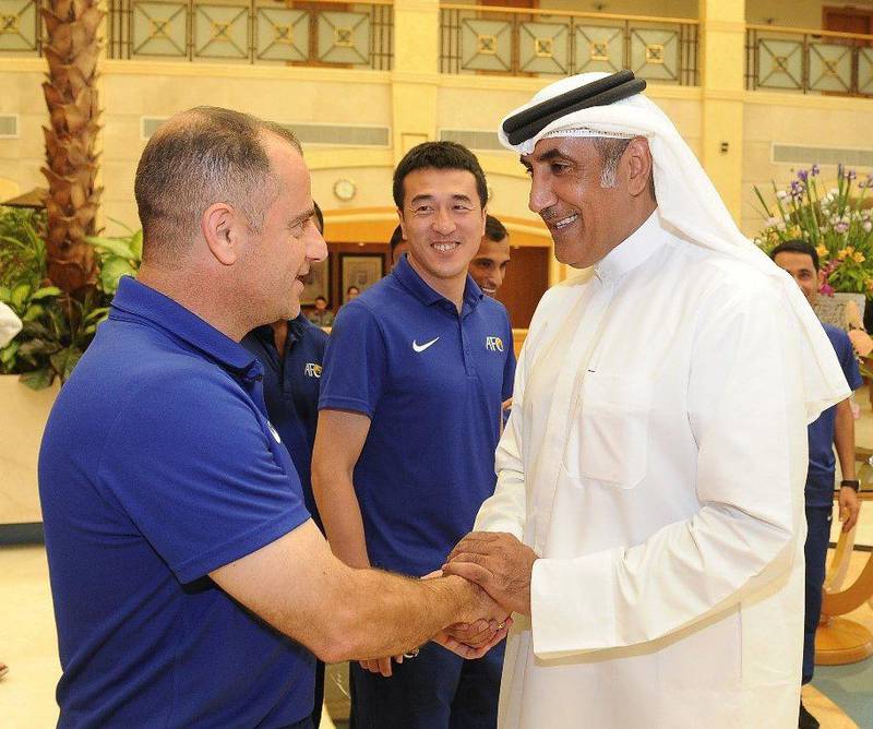 Maj Gen Mohammed Khalfan Al Romaithi shakes the hand of a member of the AFC under 23 teams at the Asian Cup qualifiers in Al Ain