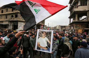 Iraqi mourners gather for the funeral of an anti-government protester who died from injuries sustained in previous confrontations with security forces, in the capital Baghdad on December 3, 2019. AFP