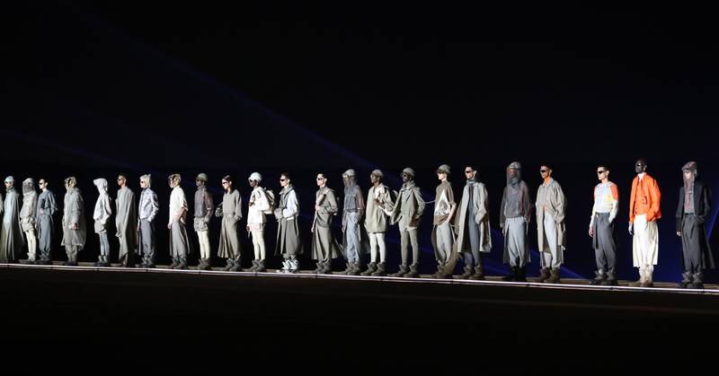For the grand finale, all 75 models made one last pass by the audience before standing in a line in front of the pyramids and leaving the stage. EPA