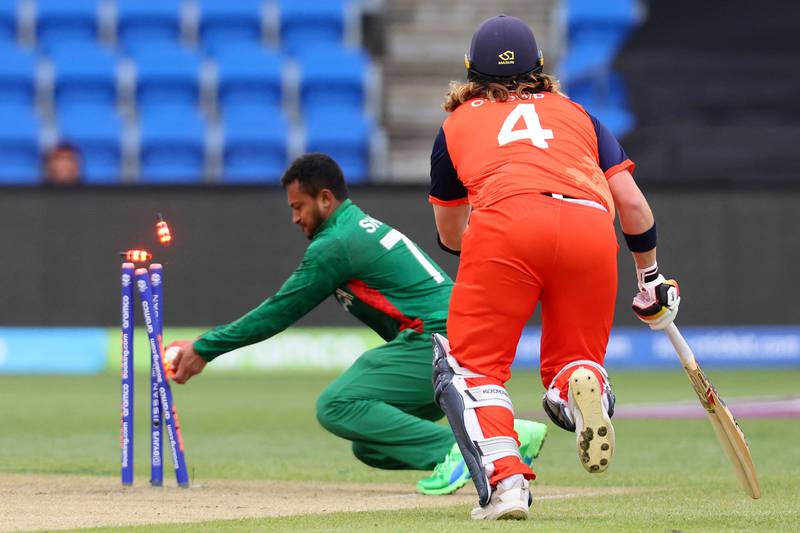 Bangladesh's Shakib Al Hasan takes the bails off to run out Netherlands' Max O'Dowd. AFP
