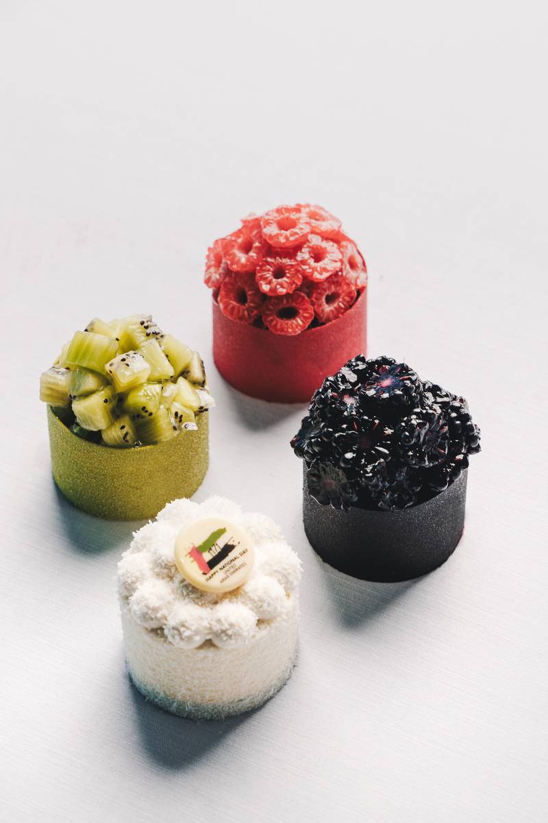 Four different cheesecakes in the four colours of the UAE flag. Photo: Sahn Eddar