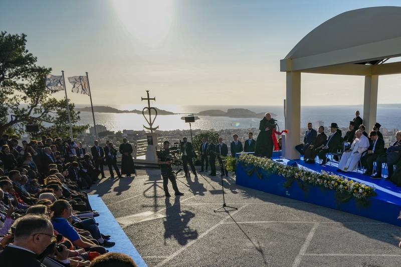 Pope Francis leads a moment of reflection with religious leaders next to the memorial. AP 