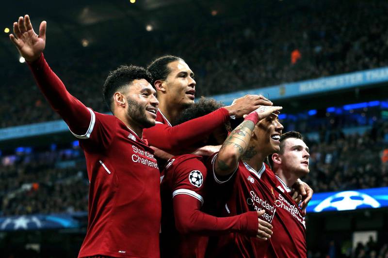 epa06660313 Liverpool's Roberto Firmino (2-R) celebrates with his teammates after scoring the 2-1 lead during the UEFA Champions League quarter final second leg match between Manchester City and FC Liverpool in Manchester, Britain, 10 April 2018.  EPA/Nigel Roddis