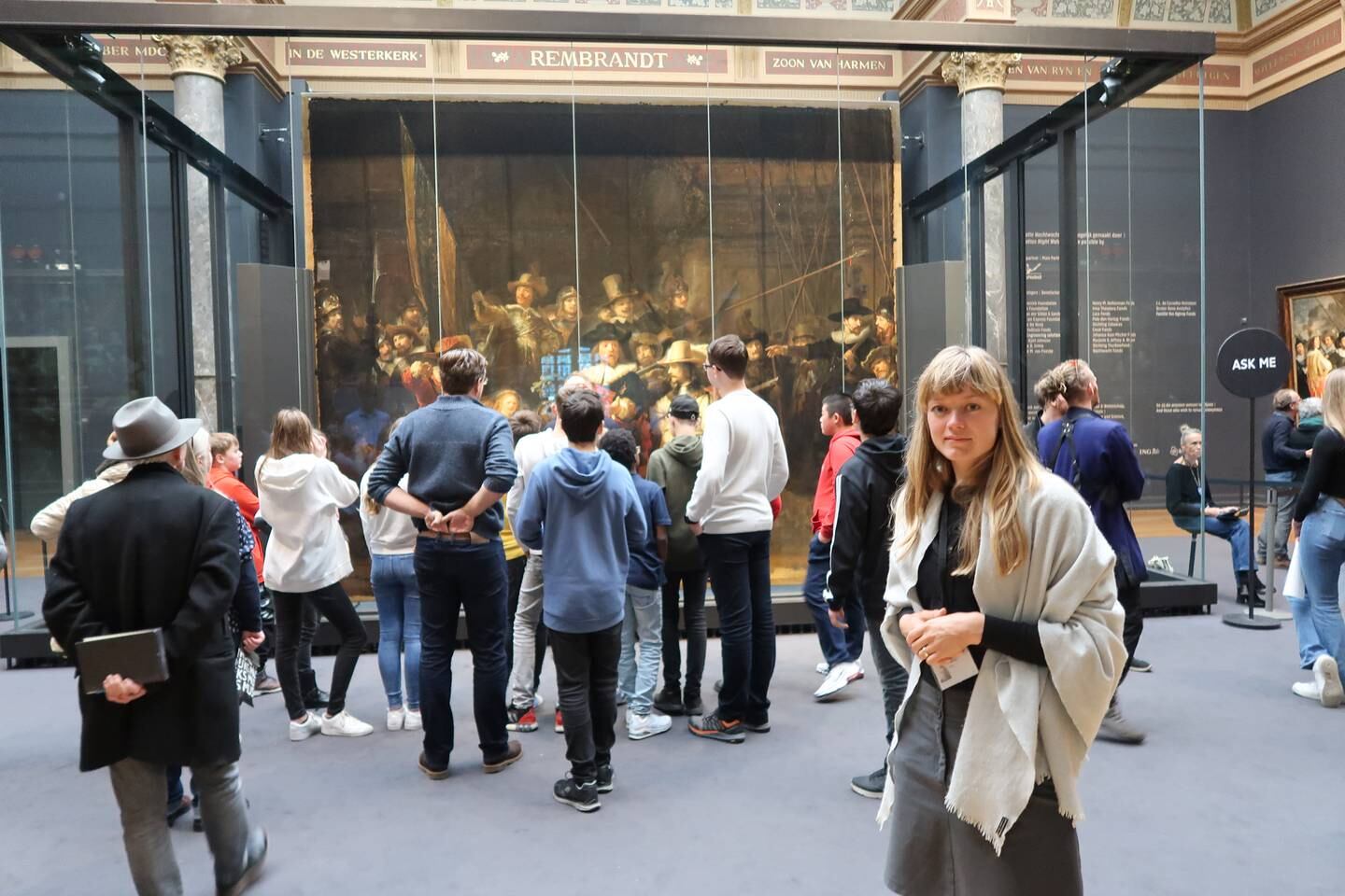 Dutch artist and art historian Lisa Wiersma stands in front of Rembrandt's 'The Night Watch' at the Rijksmuseum. Photo: Sarah Hassan
