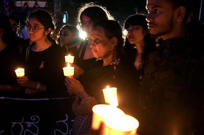 People hold a candlelight vigil in support of sexual assault victims and against the alleged rape and murder of a 27-year-old veterinary doctor in Hyderabad, in Bangalore. AFP